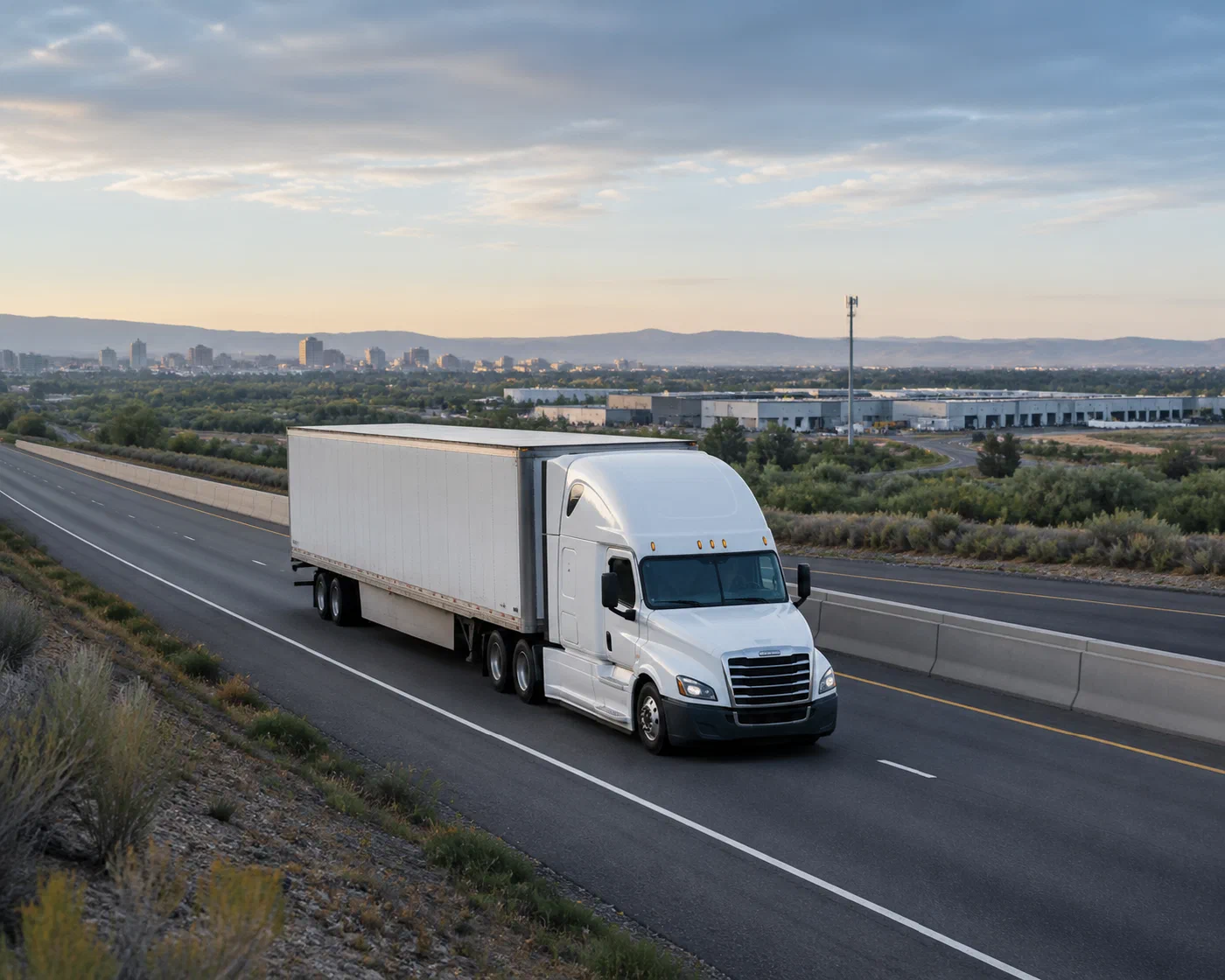 An unbranded dedicated tractor-trailer moving along a clear highway lane