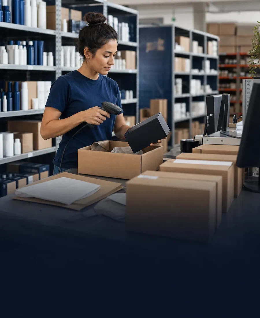 A fulfillment specialist scanning a packed customer order